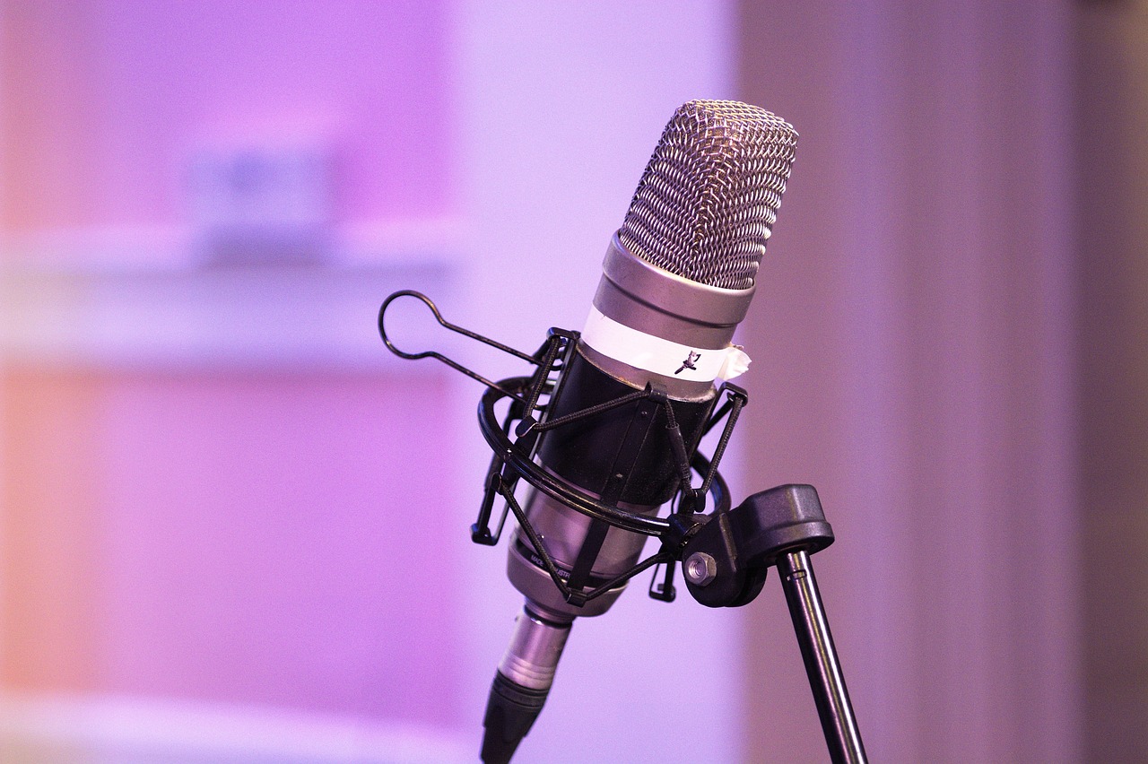 The Authority Boost represented by a podcast microphone against a purple/pink background